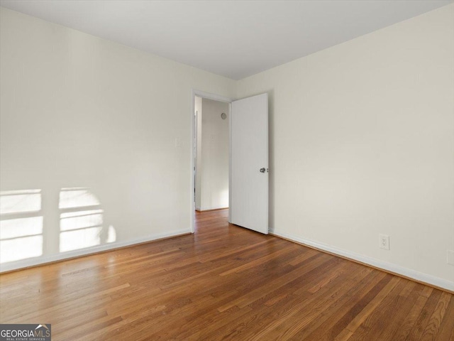 spare room featuring hardwood / wood-style flooring