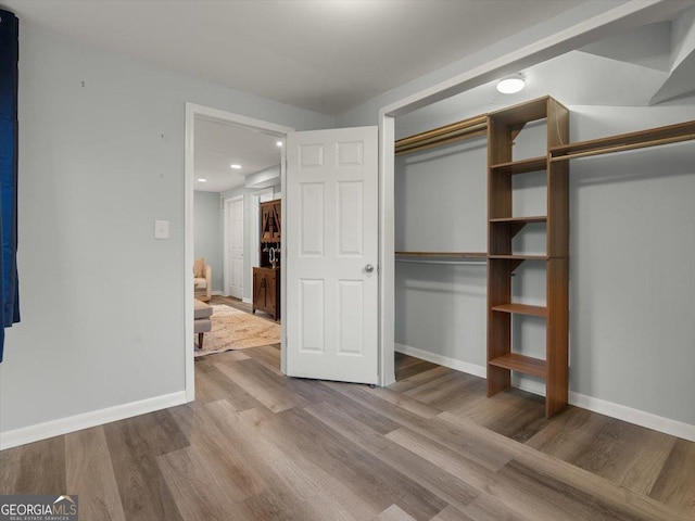 interior space featuring a closet and light wood-type flooring