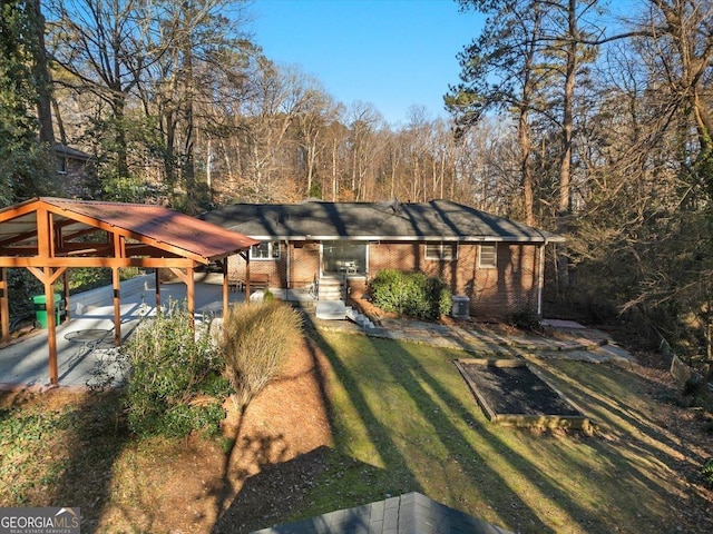 view of front facade with a front lawn and central AC unit