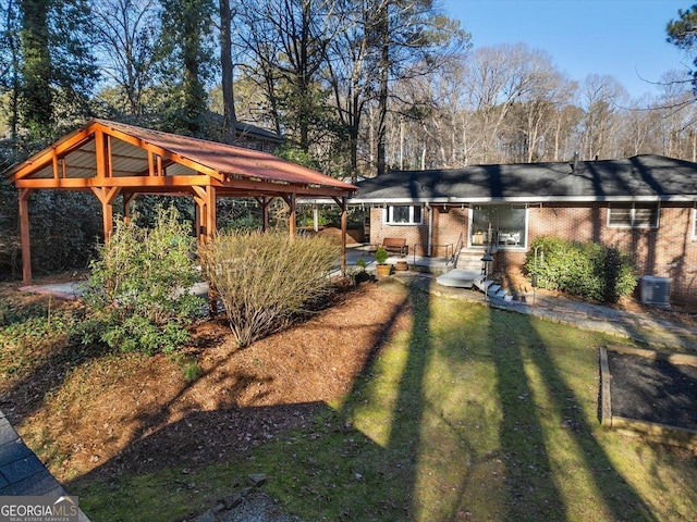 view of yard featuring a gazebo and cooling unit