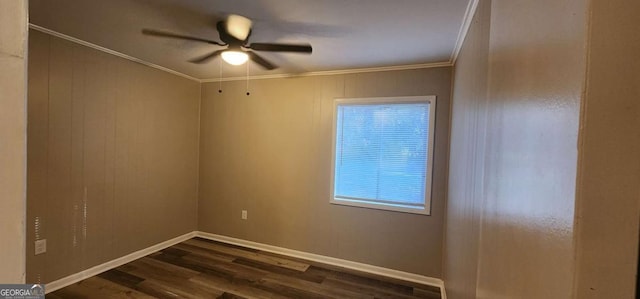 spare room with ceiling fan, dark hardwood / wood-style flooring, and ornamental molding