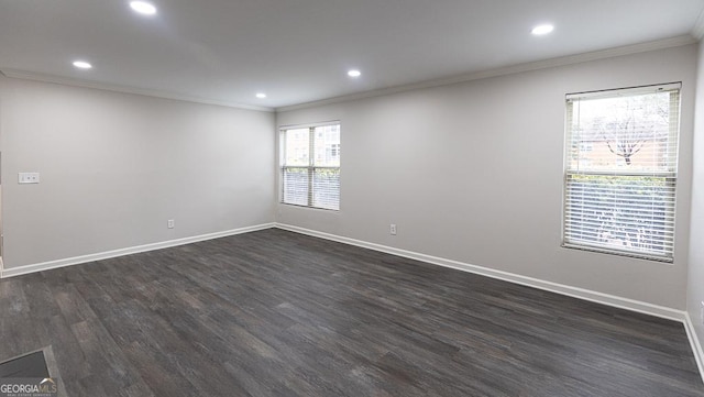 unfurnished room featuring crown molding and dark hardwood / wood-style flooring