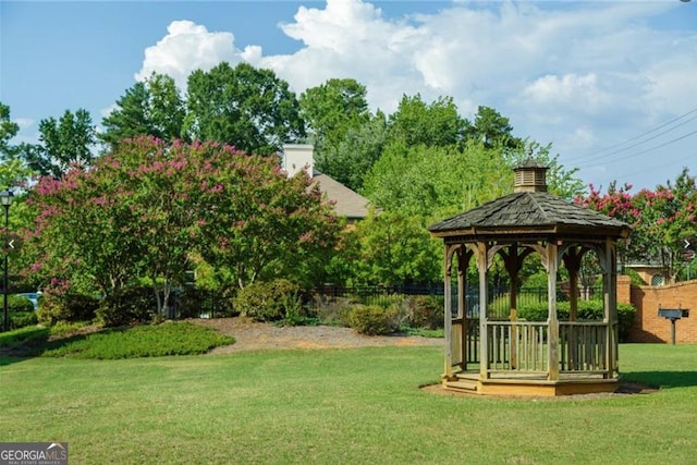 exterior space featuring a gazebo and a lawn