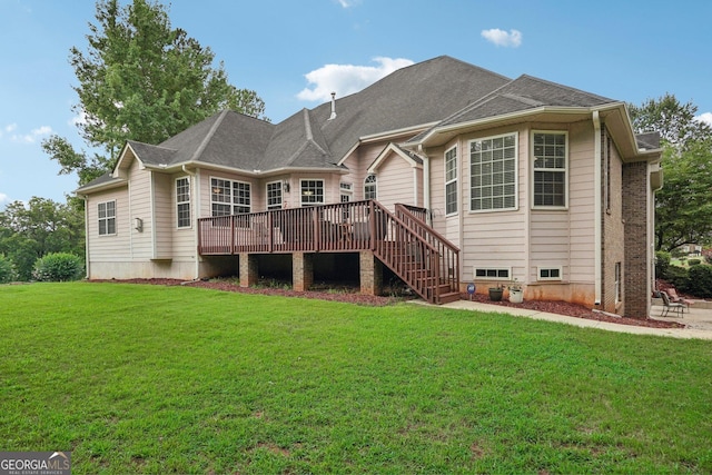 back of house with stairs, a yard, a shingled roof, and a wooden deck