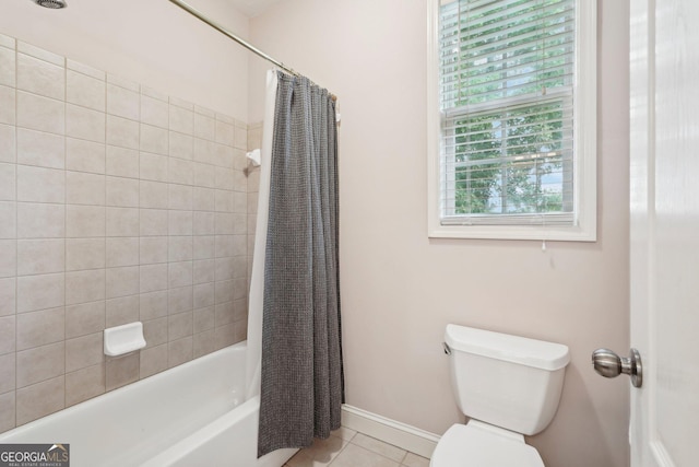 full bath with shower / bath combination with curtain, tile patterned flooring, baseboards, and toilet