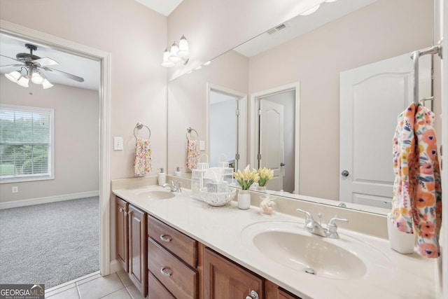 bathroom featuring tile patterned flooring, visible vents, a sink, and double vanity