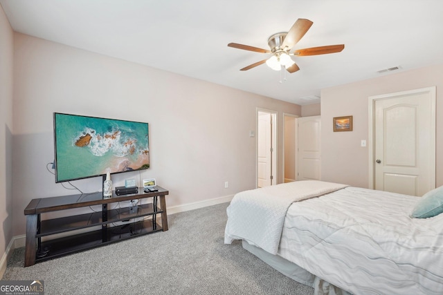 carpeted bedroom with ceiling fan, visible vents, and baseboards