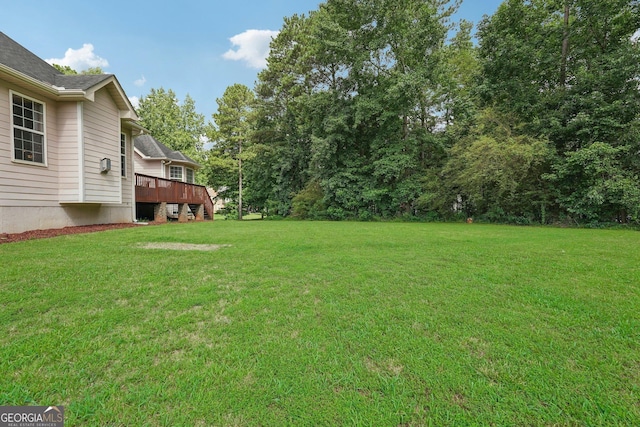 view of yard featuring a deck