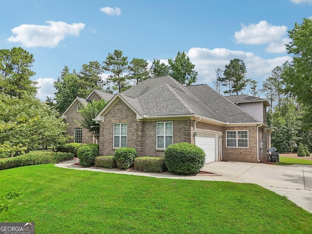 view of front of property featuring a garage, brick siding, driveway, roof with shingles, and a front lawn