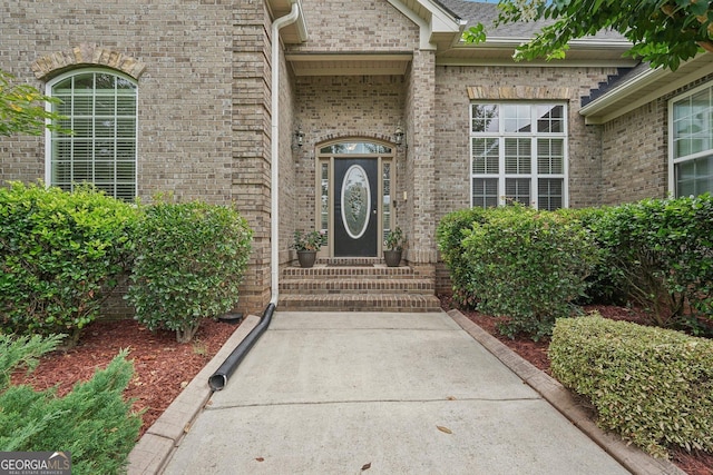 entrance to property with brick siding