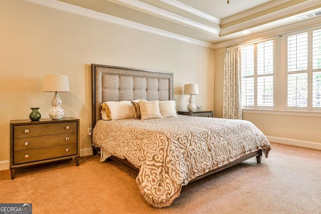 carpeted bedroom featuring a tray ceiling, multiple windows, and crown molding