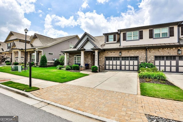 view of front facade with a front yard and a garage