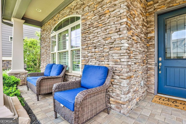 entrance to property featuring covered porch