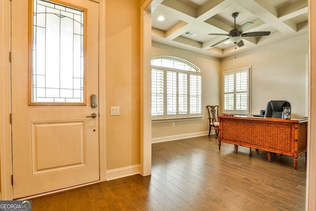 office space featuring beamed ceiling, dark hardwood / wood-style floors, ceiling fan, and coffered ceiling