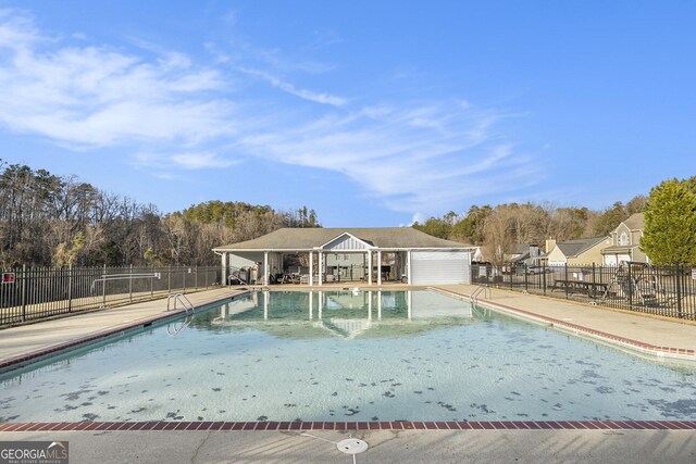 view of pool featuring a patio