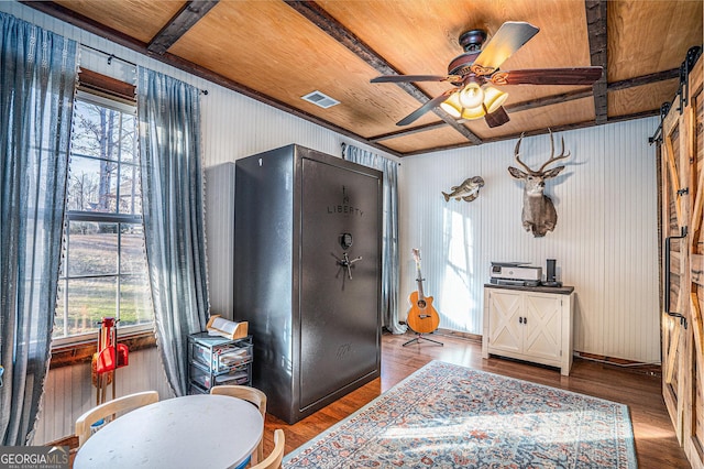 interior space with wood ceiling, ceiling fan, and wood-type flooring