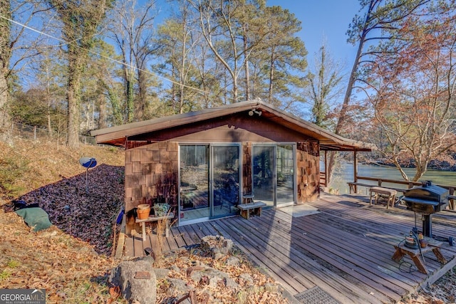 wooden terrace with a water view