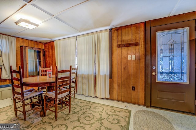 dining area with wooden walls