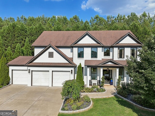 view of front of house featuring a porch and a garage