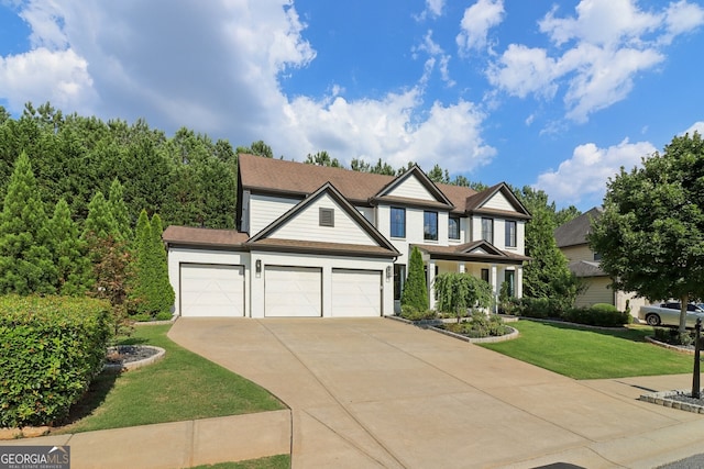 view of front of property with a garage and a front lawn