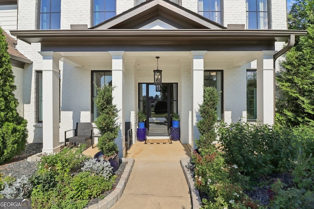 doorway to property with covered porch