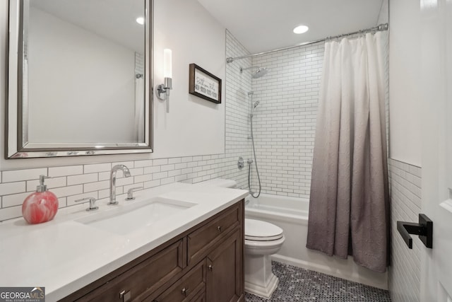 full bathroom with shower / bath combination with curtain, vanity, toilet, and tile patterned floors