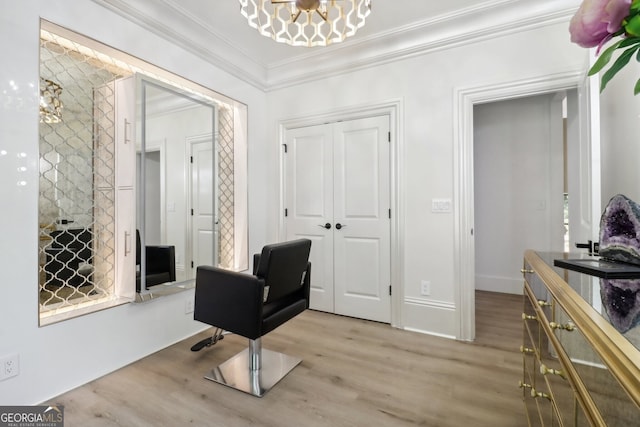 interior space featuring light wood-type flooring, crown molding, and a chandelier