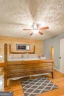 bedroom featuring wood finished floors