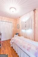 bedroom with light wood-style floors