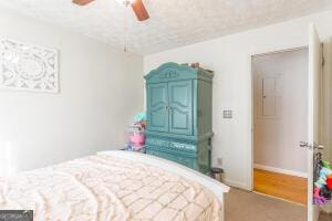 bedroom with baseboards and a ceiling fan