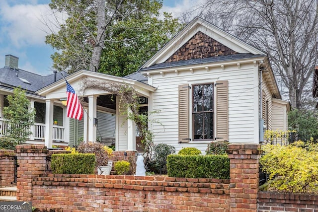 greek revival house featuring covered porch