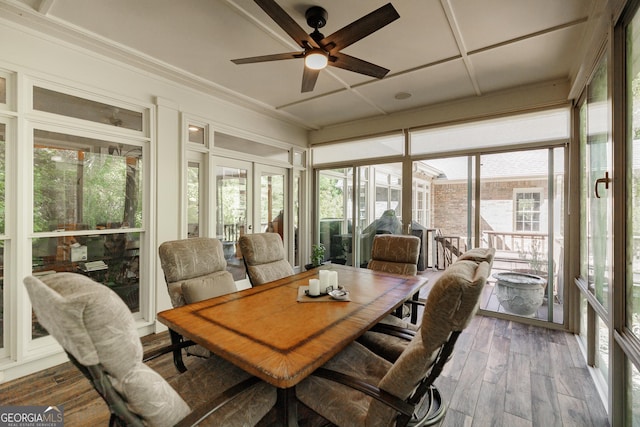 sunroom / solarium with french doors and ceiling fan