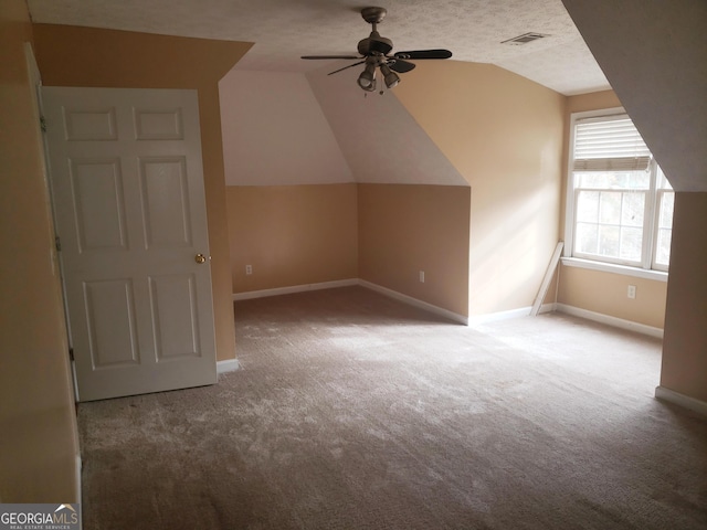 bonus room with carpet, ceiling fan, and lofted ceiling