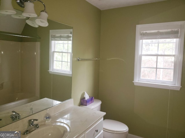 full bathroom with plenty of natural light, toilet, shower / tub combination, and vanity