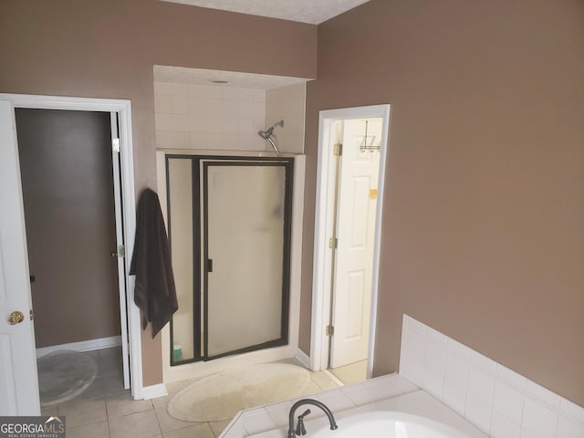 bathroom featuring tile patterned flooring and plus walk in shower