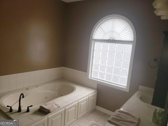 bathroom featuring tile patterned floors, a bathtub, and sink