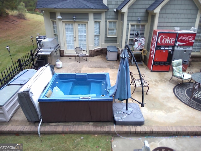 view of pool featuring french doors, a patio, and a grill