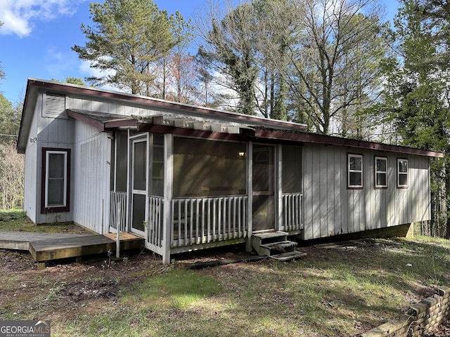 back of property featuring a deck