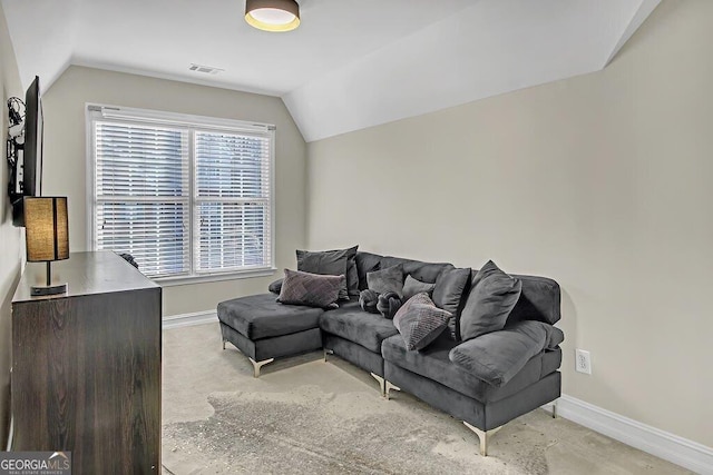 living room featuring vaulted ceiling