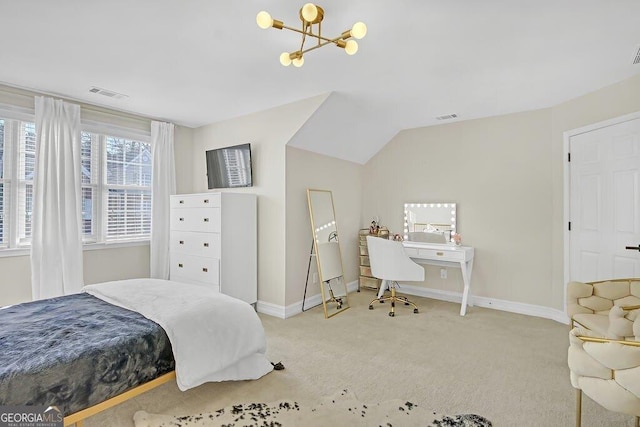 carpeted bedroom with a chandelier