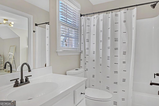 full bathroom with vanity, toilet, and shower / bath combo with shower curtain