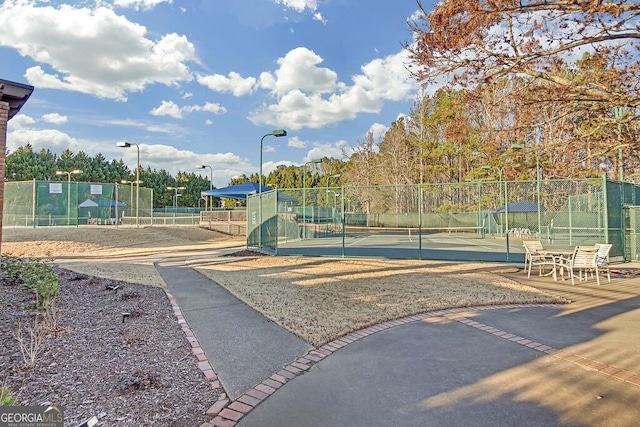 exterior space featuring tennis court