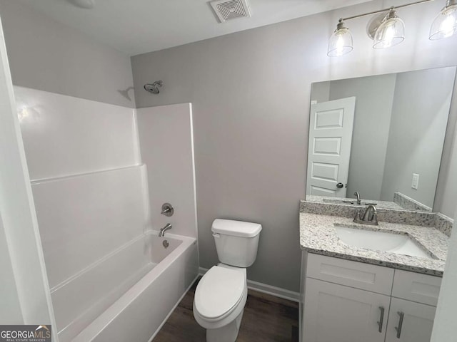 full bathroom featuring shower / tub combination, vanity, toilet, and wood-type flooring