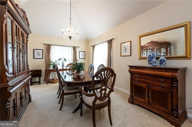 carpeted dining area with vaulted ceiling and a chandelier