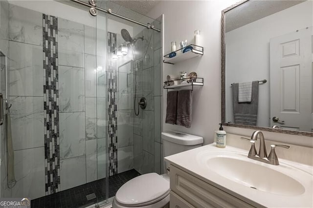 bathroom featuring vanity, toilet, and an enclosed shower