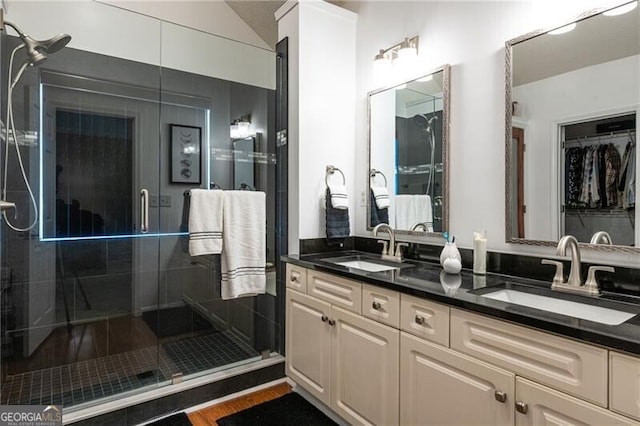 bathroom featuring vanity and walk in shower