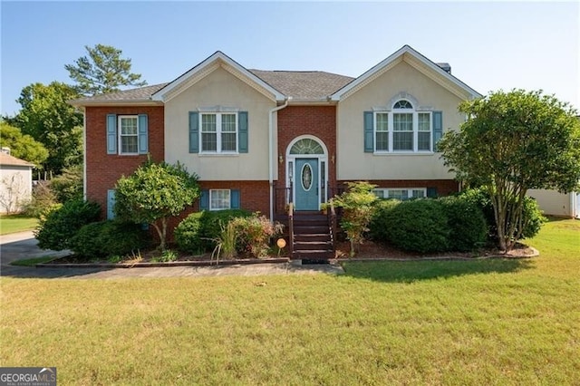 bi-level home with a front yard