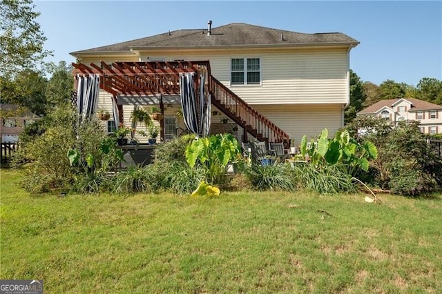 rear view of house with a pergola and a yard