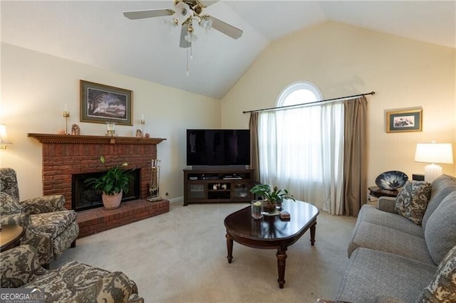 carpeted living room with ceiling fan, lofted ceiling, and a brick fireplace