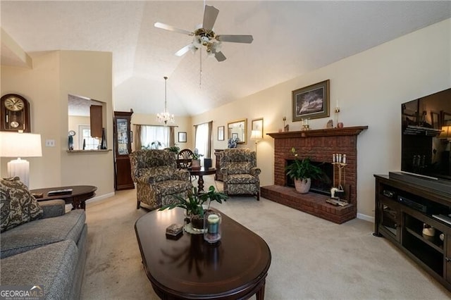 living room featuring lofted ceiling, a fireplace, light carpet, and ceiling fan with notable chandelier